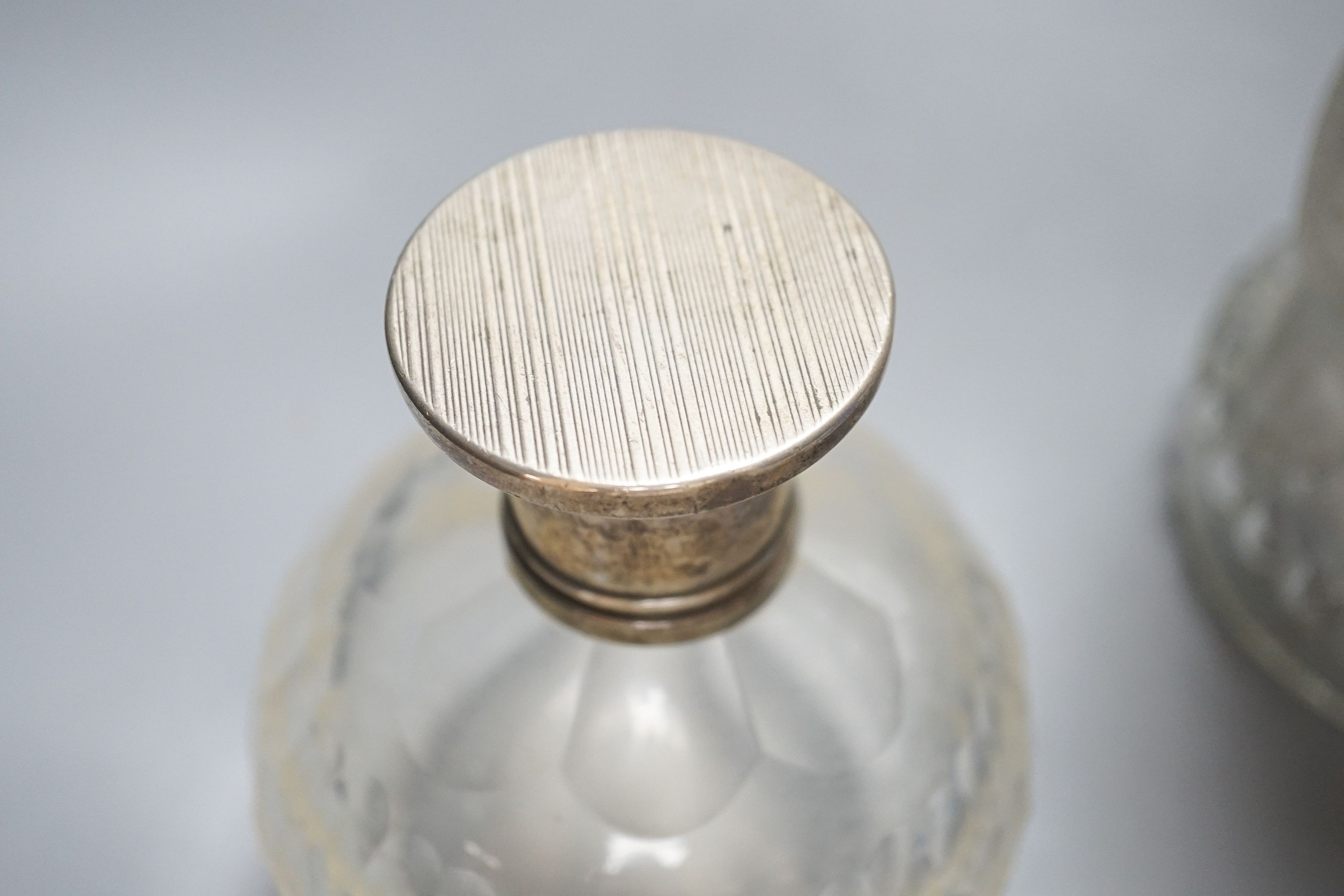 An American novelty dog decanter, silver topped perfume bottle, blue perfume bottle and three candy stripe bottles 32cm